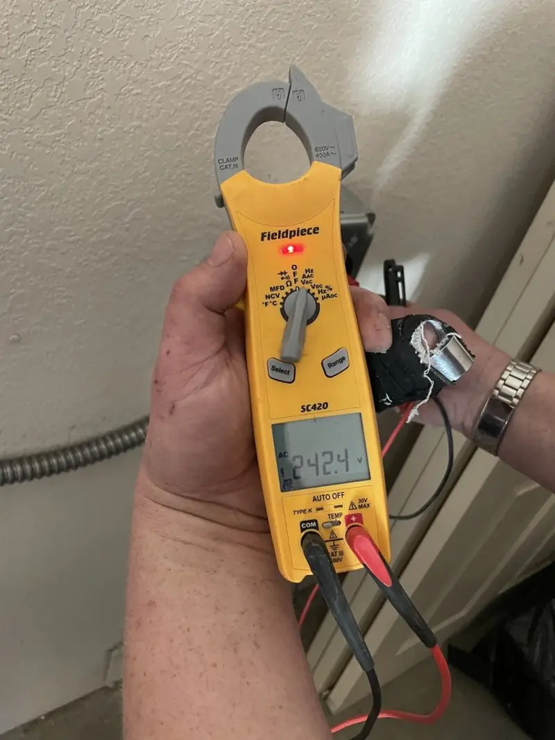 Voltage testing with clamp meter during Outlet Installation in Hollins